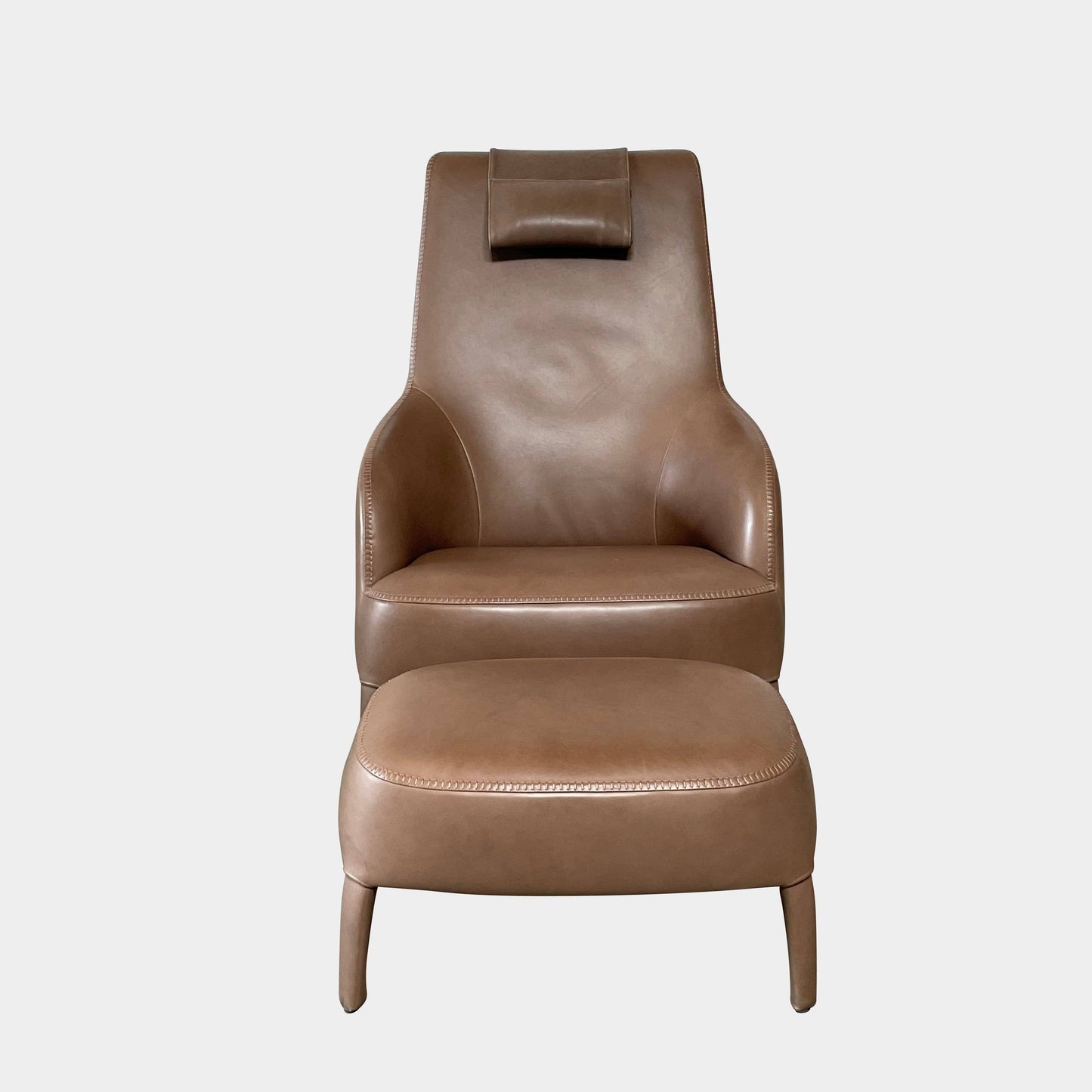 Fauteuil à dossier haut et pouf Maxalto Febo