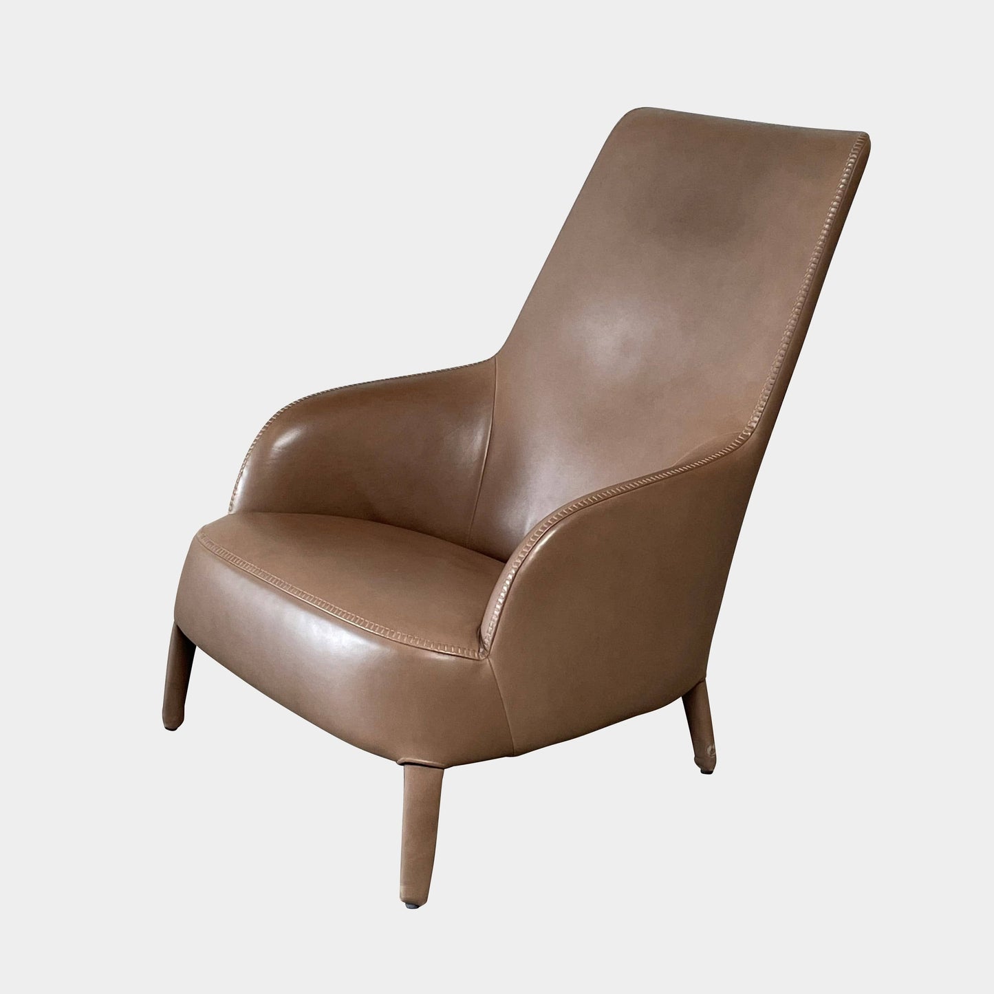 Fauteuil à dossier haut et pouf Maxalto Febo