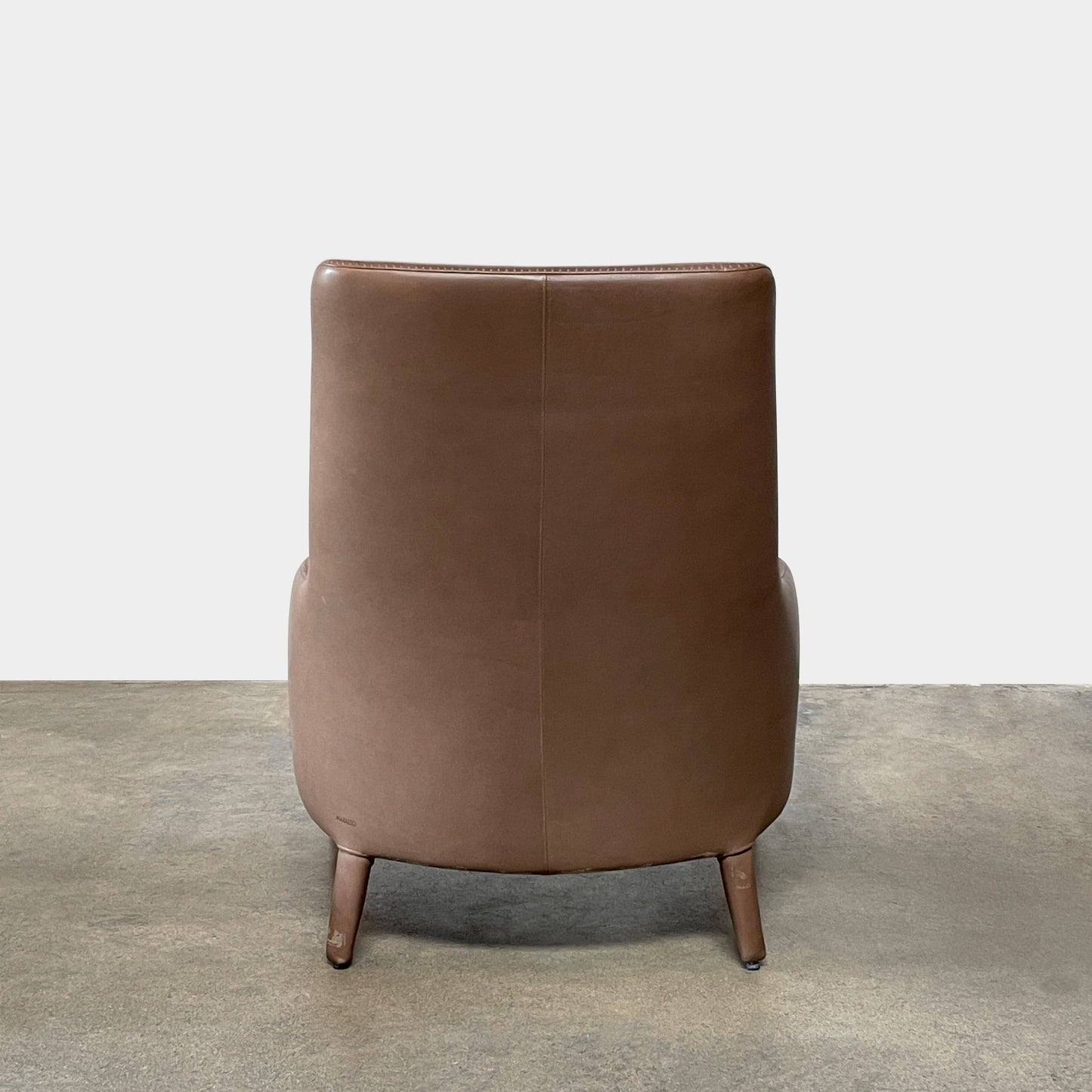 Fauteuil à dossier haut et pouf Maxalto Febo